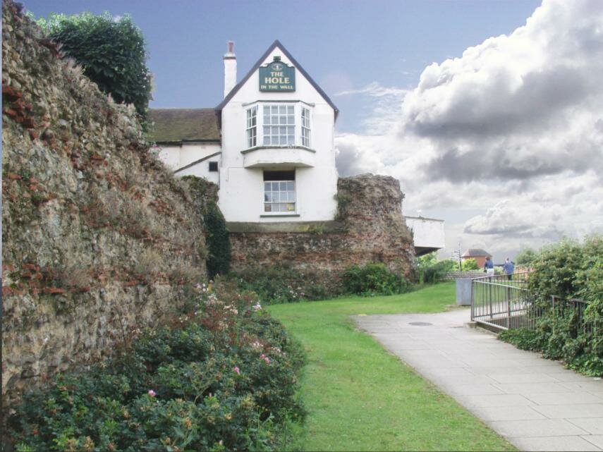The Hole in the Wall Pub and the Roman Wall, Colchester, Essex, England, Great Britain