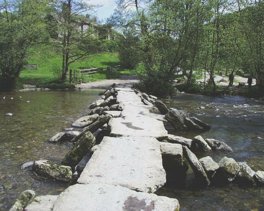 View of Tarr Steps Clapper Bridge crossing the River Barle, Exmoor, Somerset
